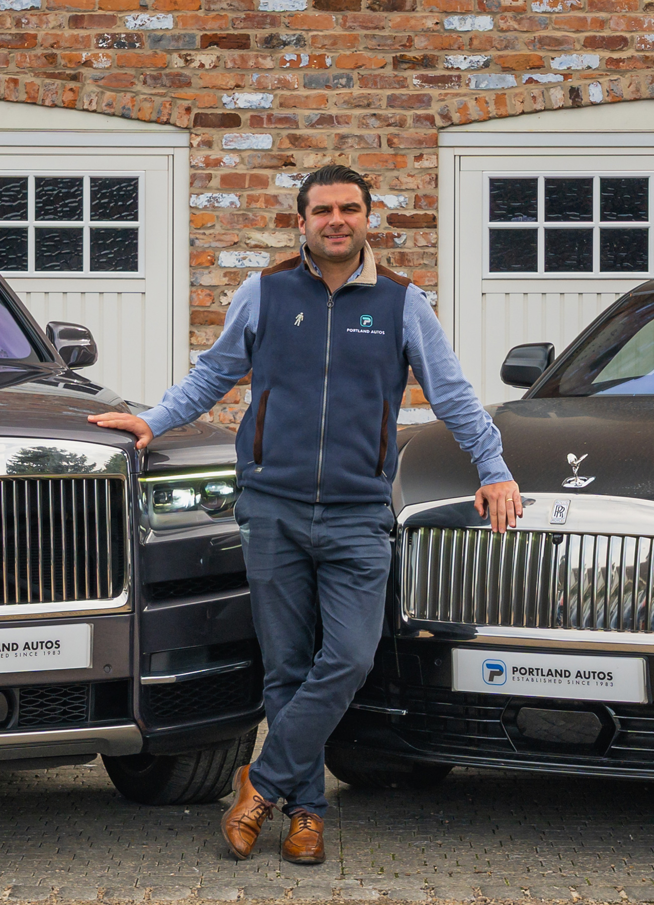 Adam watson with rolls royce cars